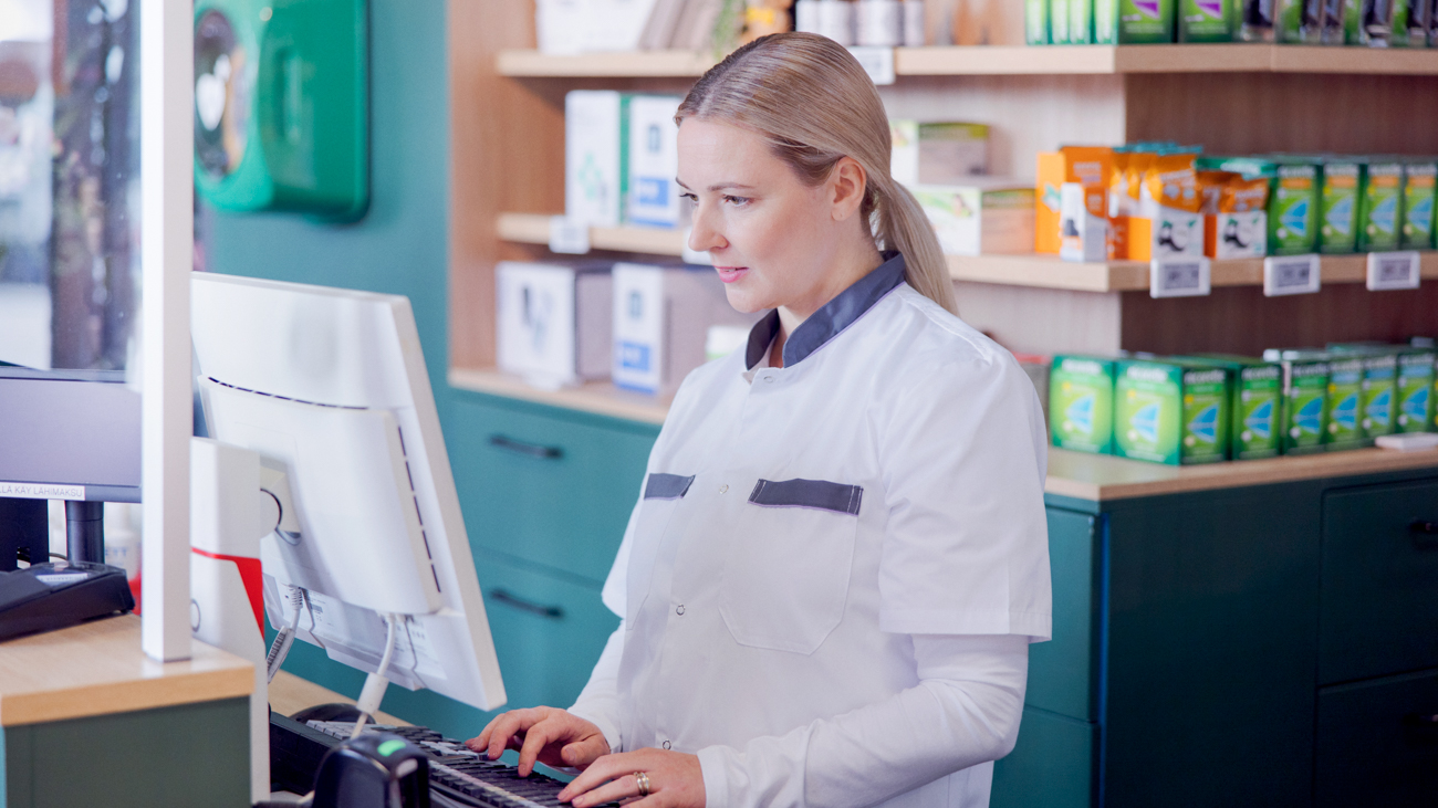 A pharmacist on computer.