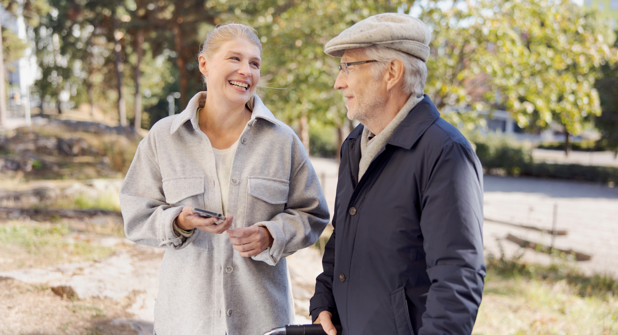 An old man takes a stroll with his daughter.
